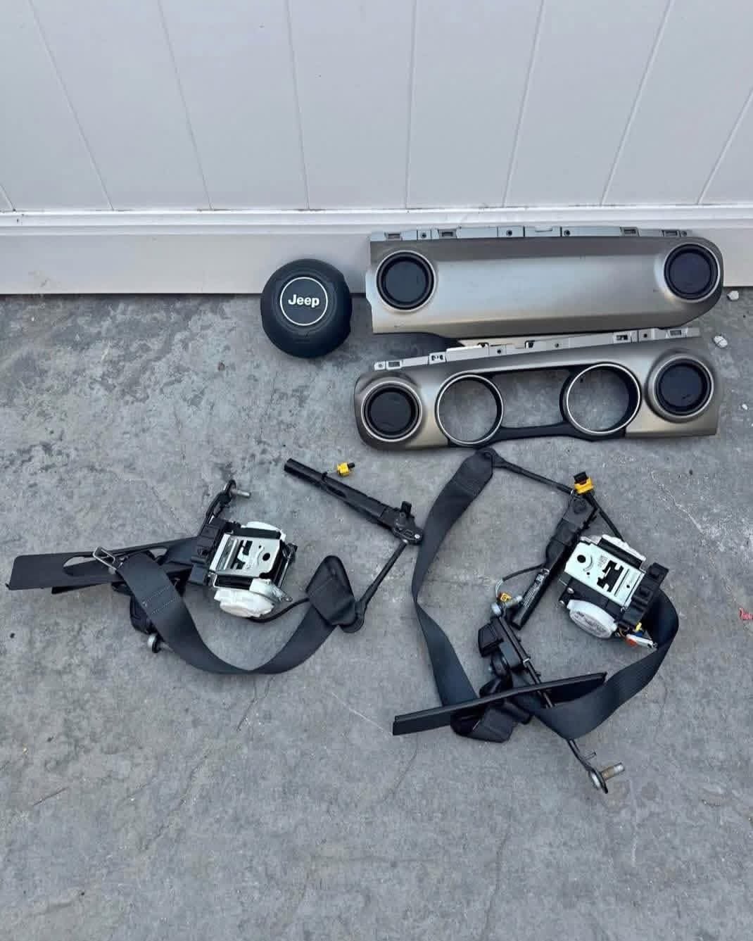WhatsApp Image 2025-12-05 at 8.47.11 PM dashboard trim pieces and seatbelt assemblies, for a Jeep Wrangler/Gladiator models - Image 1