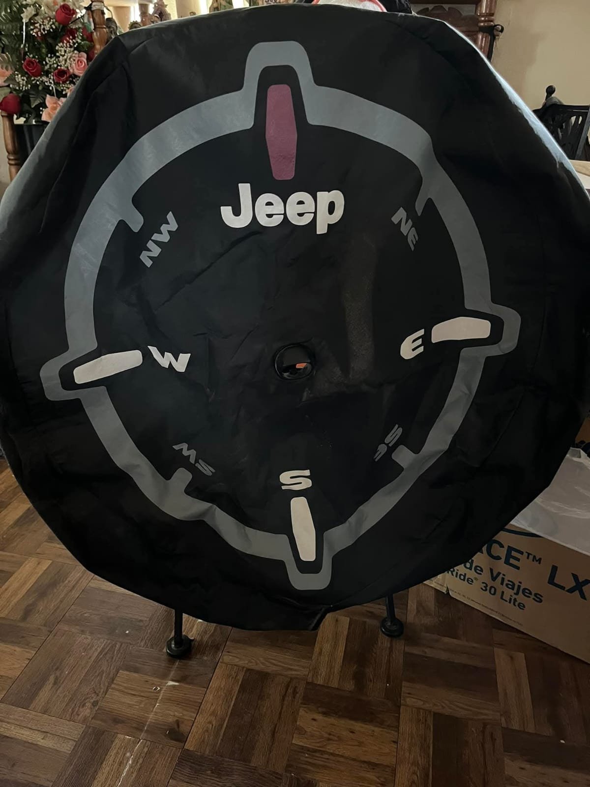 WhatsApp Image 2025-12-06 at 7.19.44 AM Mopar Genuine Jeep Wrangler spare tire cover with a compass design. - Image 1