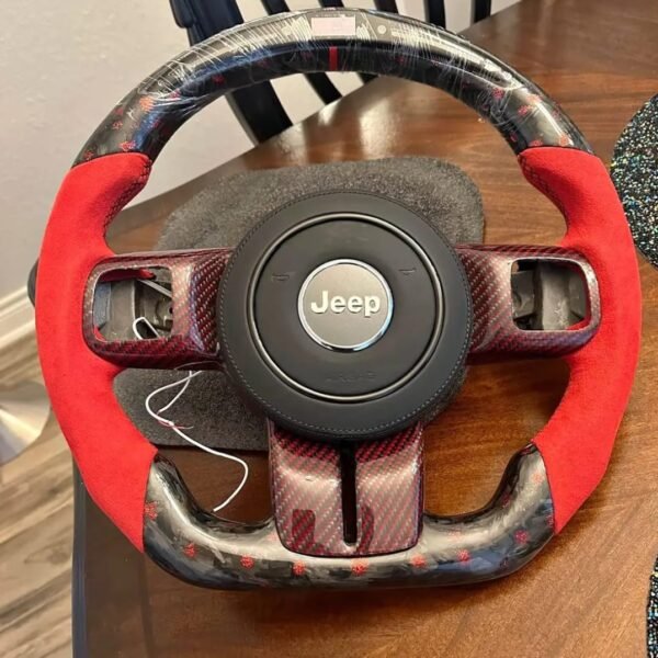 custom carbon fiber and red suede steering wheel for a Jeep Wrangler.
